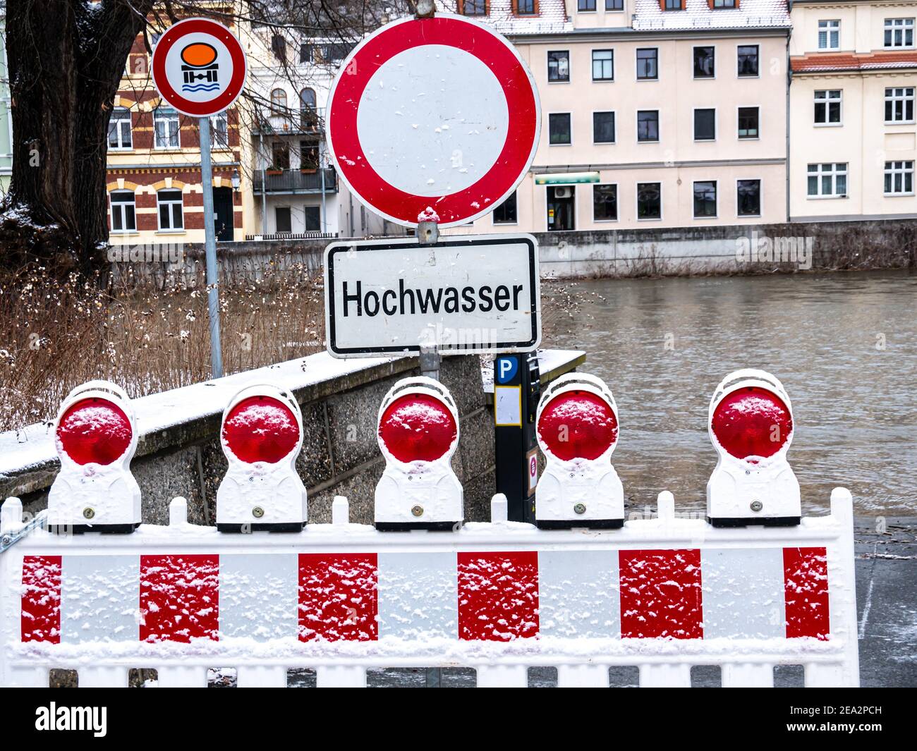 Caution flood warning sign due to melting snow Stock Photo