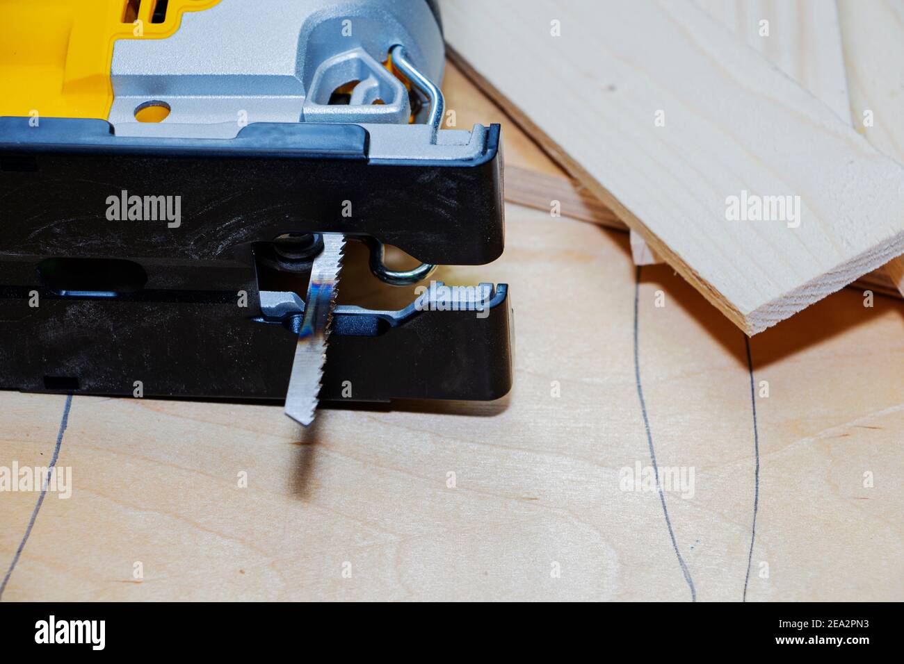 power tools, working with an electric jigsaw and wood. Stock Photo