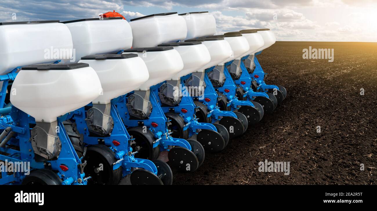 Agricultural seeding machine on the field Stock Photo