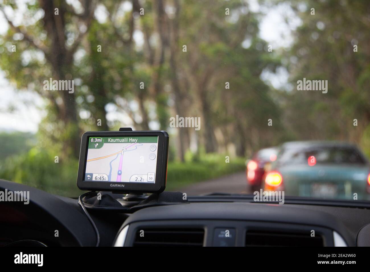 KAUAI,HAWAII, USA: selective focus. Traffic jam in the evening. The navigator is in the foreground. Stock Photo