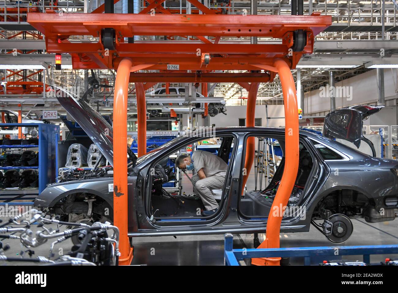 Changchun, China's Jilin Province. 5th Jan, 2021. A worker assembles a vehicle at the general assembly line of FAW-Volkswagen in Changchun, northeast China's Jilin Province, Jan. 5, 2021. China's leading automaker FAW Group Corporation sold 420,458 vehicles in January, up 18.9 percent year on year, the company said on Sunday. Credit: Zhang Nan/Xinhua/Alamy Live News Stock Photo