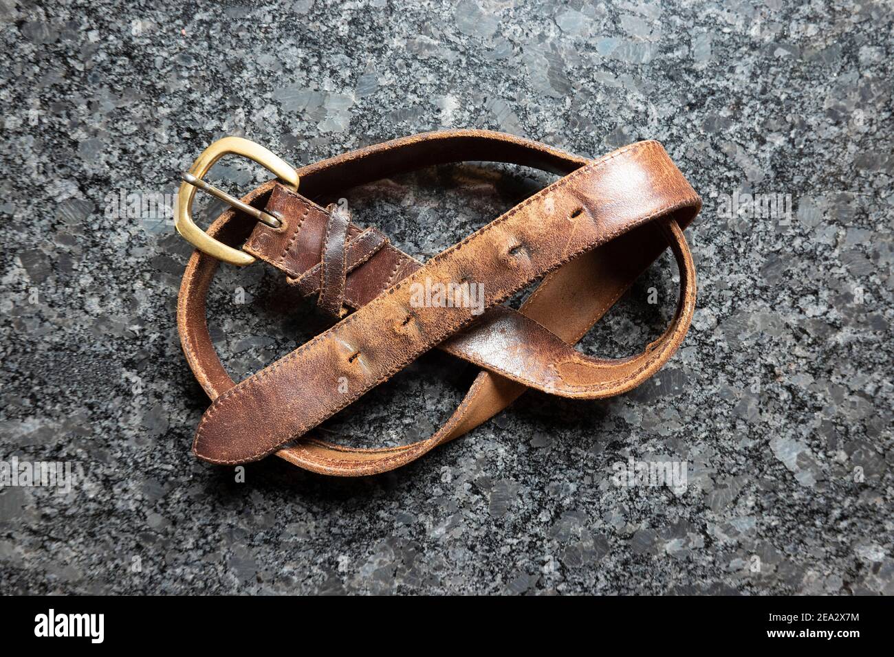 old-mens-leather-belt-with-worn-notches-2EA2X7M.jpg