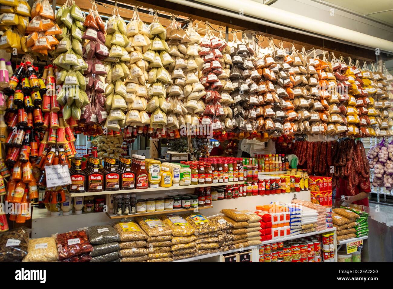 Rows of small packets of spices on sale at a large spice store at the historic public under covered Municipal Market (Mercado Municipal de Sao Paulo) Stock Photo
