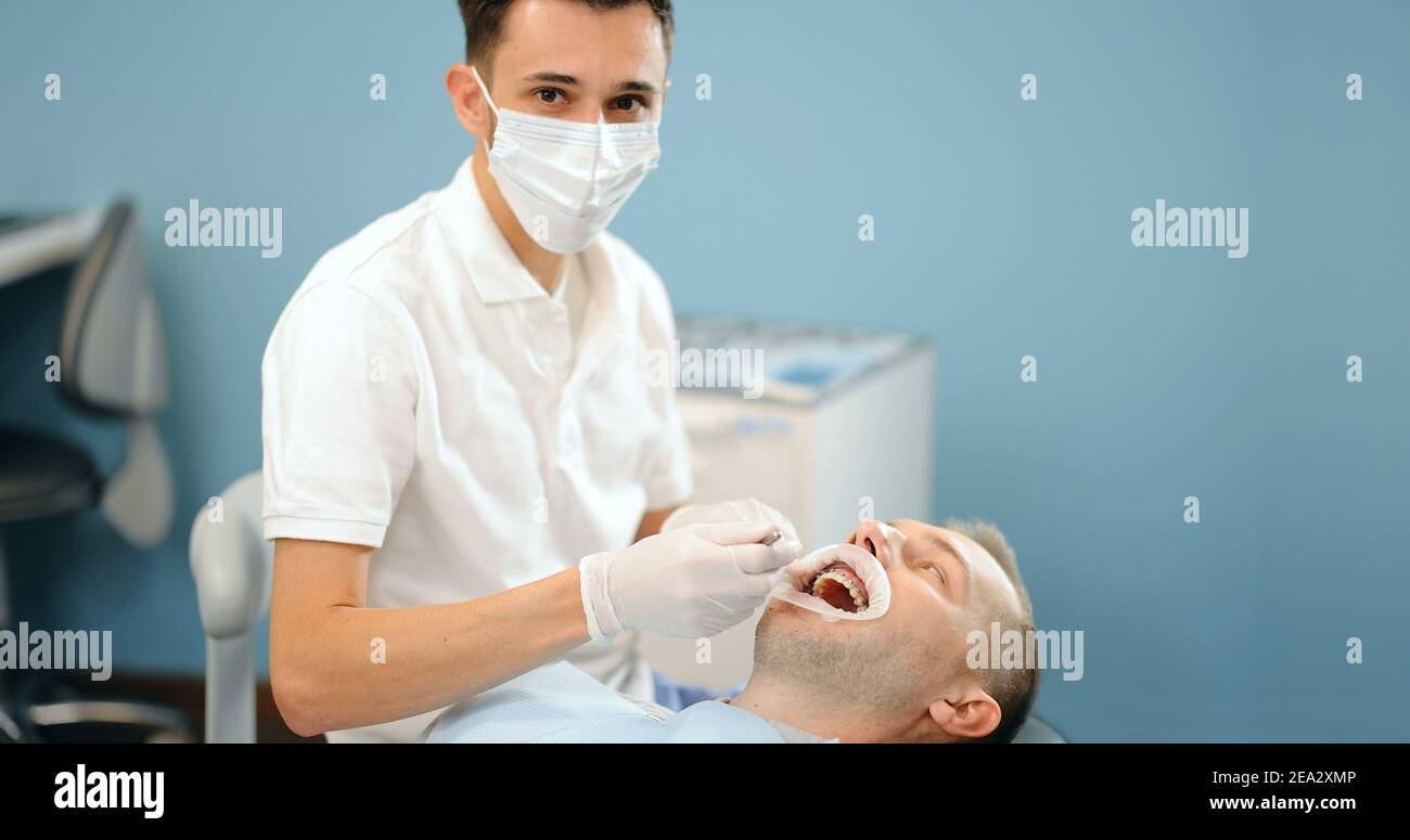 Dentist and patient during an orthodontic treatment Stock Photo Alamy