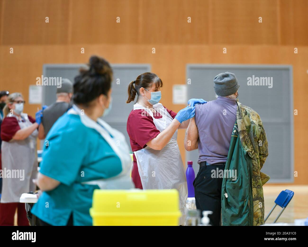 A Covid19 vaccination session held at Workington Leisure Centre in Cumbria using the Oxford Astra Zeneca vaccine. The cohort being given the vaccine are those over 70 years-old along with younger people who had been shielding or were clinically extremely vulnerable. The Workington Primary Care Network relocated from the town's surgeries to the larger space of the leisure centre to speed up the vaccine delivery to fight Coronavirus, Covid-19: 6 February 2021 STUART WALKER  Stuart Walker Photography 2021 Stock Photo