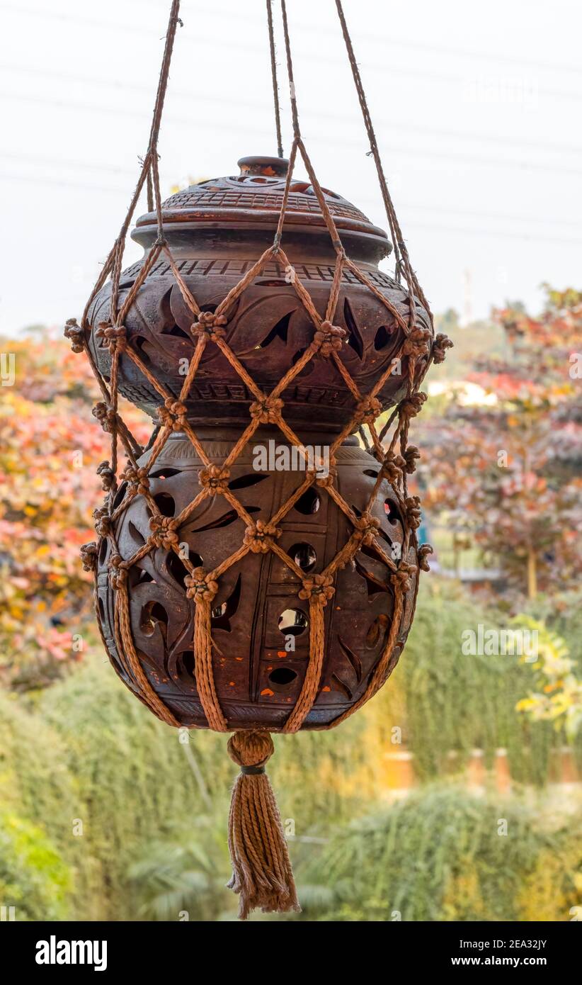 Jar With Roping Hanged decorative jars with rope portrait view Stock Photo - Alamy