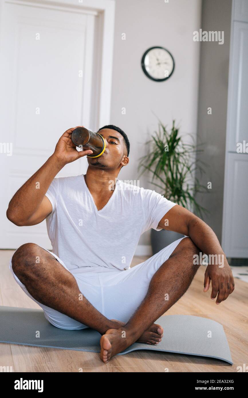 Young athletic man using big bottle of water for home workout 16290443  Stock Photo at Vecteezy