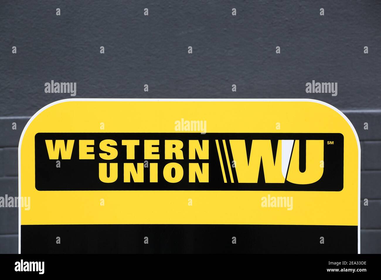Tarare, France- June 27, 2020: Western Union sign and point. The Western Union company is an american financial services and communications company Stock Photo