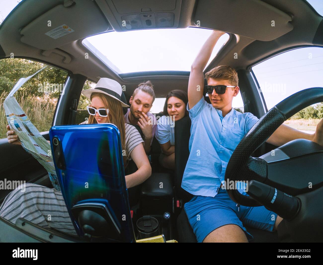group of friends in car road trip concept Stock Photo - Alamy