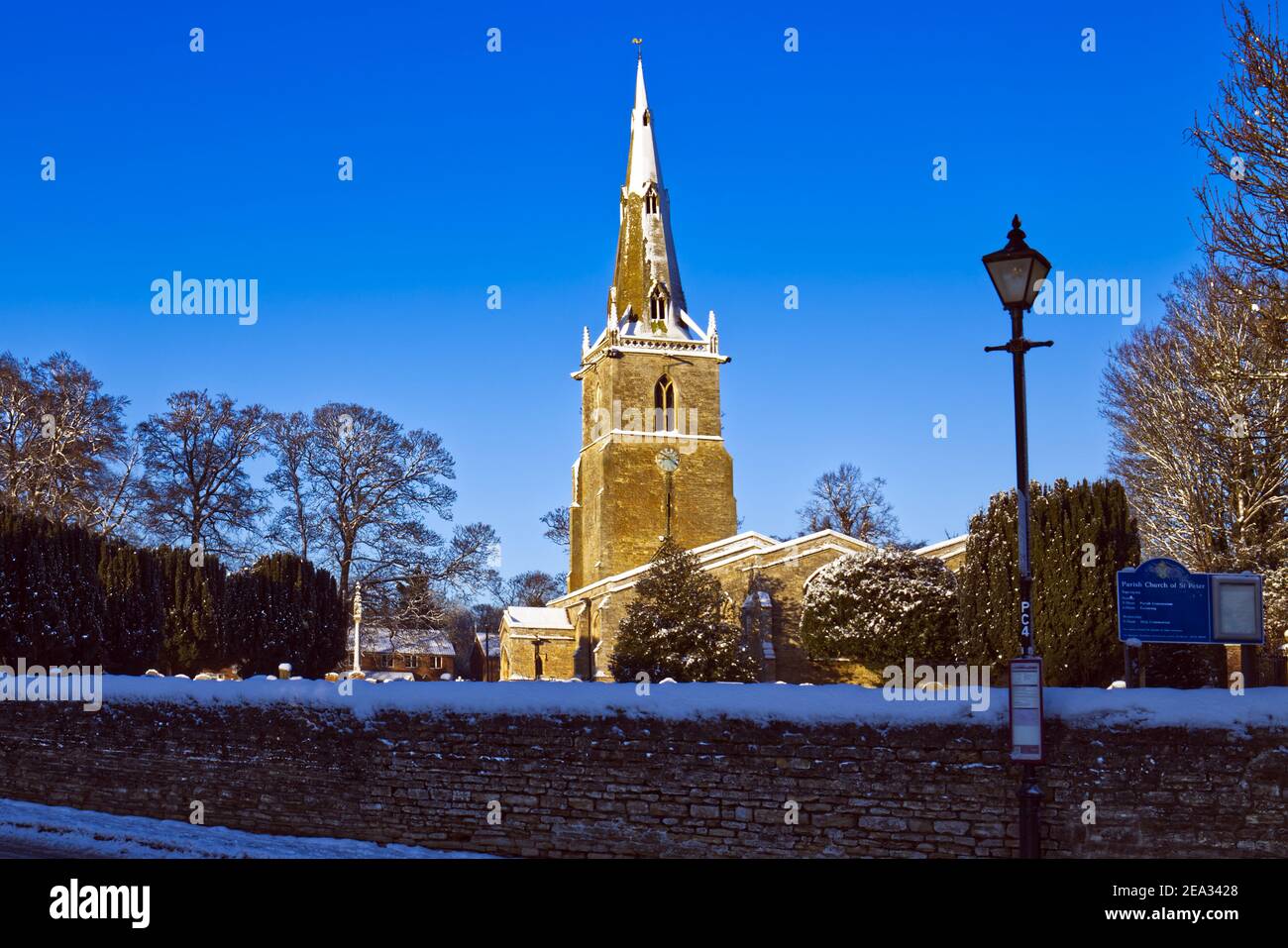 A winter scene after snow at St Peter's village church, Sharnbrook, Bedfordshire, England, UK Stock Photo