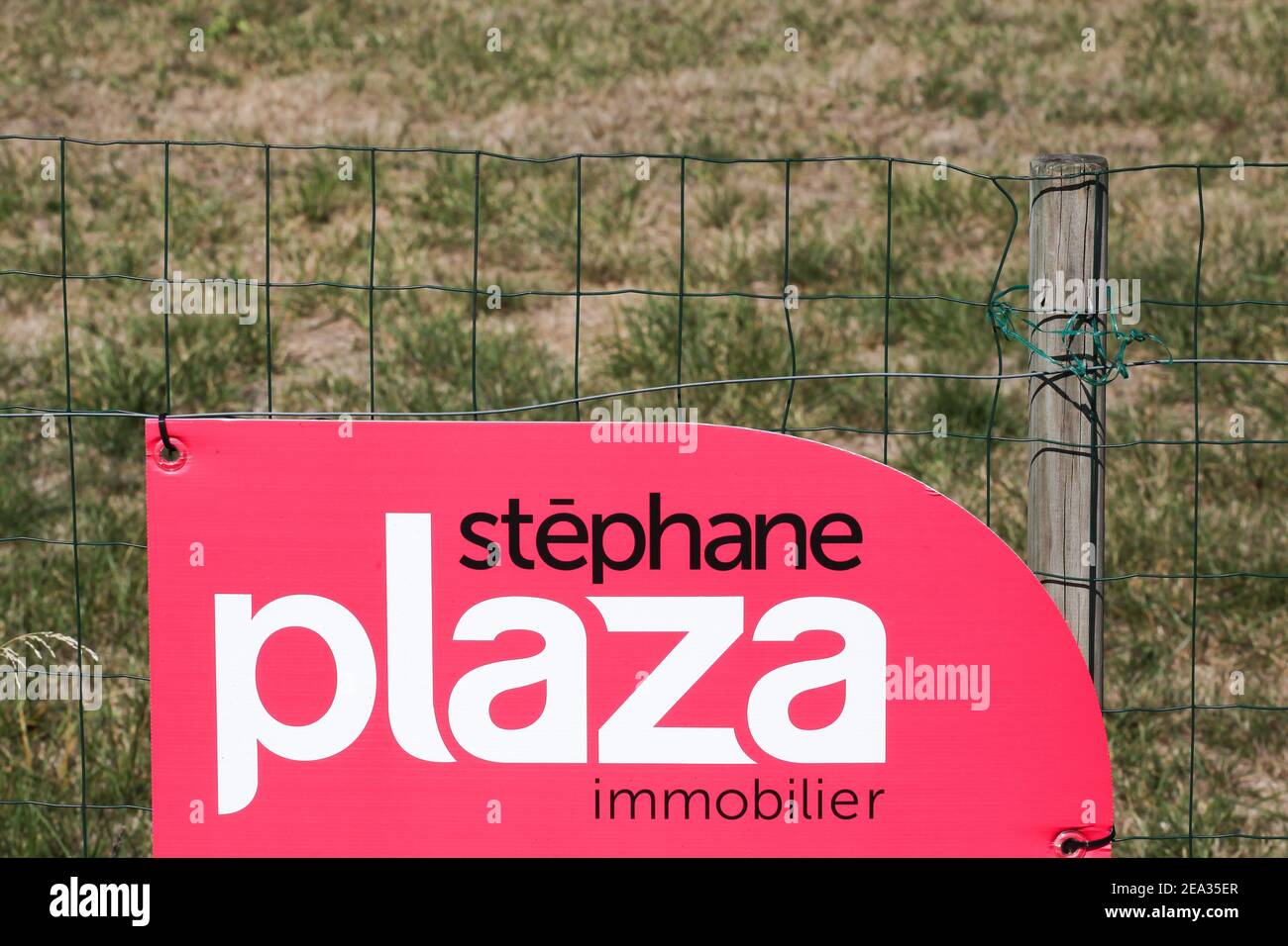 La Clayette, France - September 12, 2020: Stephane Plaza logo on a fence. Stephane Plaza Immobilier is a French network of real estate agencies Stock Photo