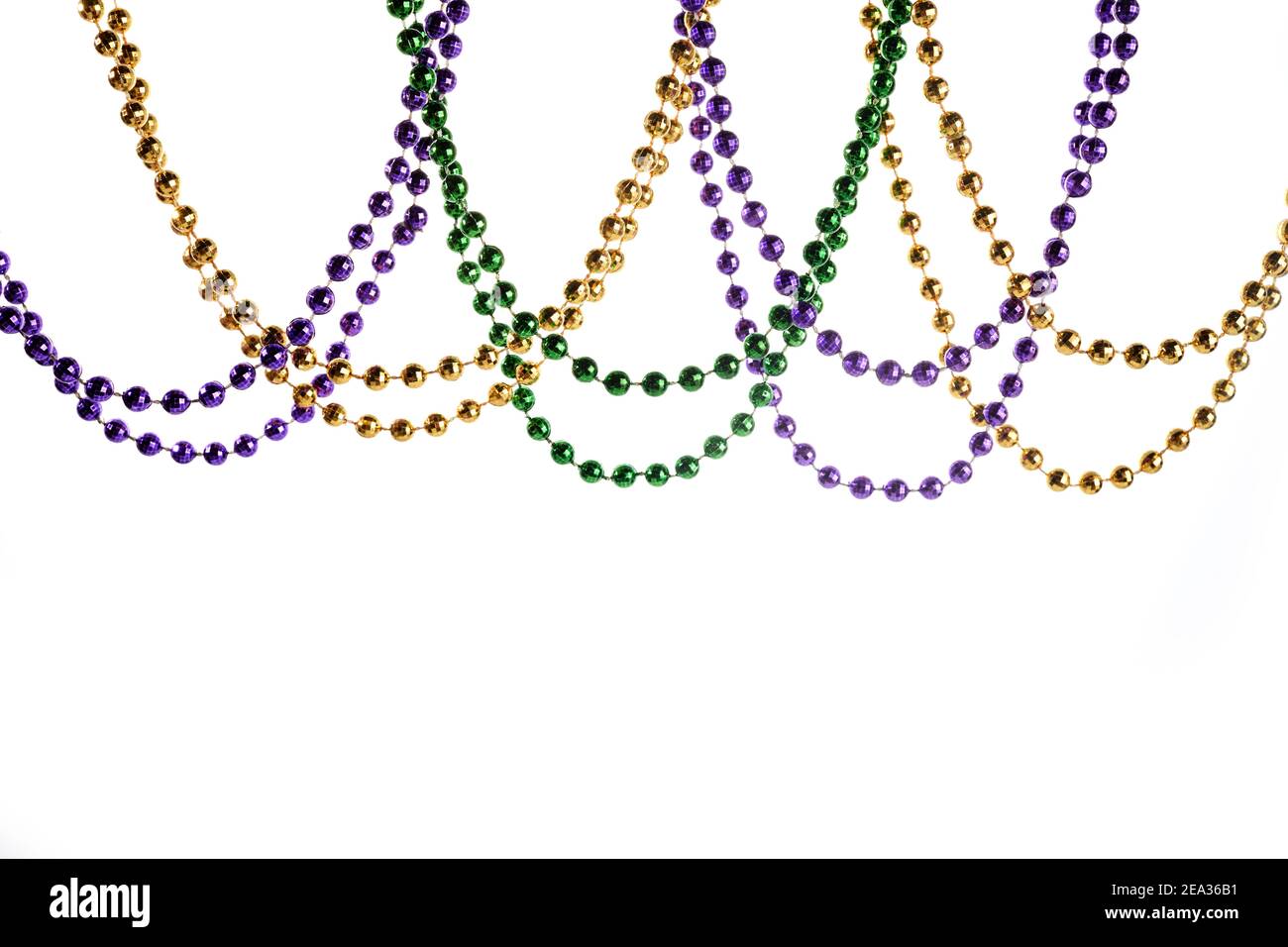 Full frame background of Mardi Gras feather boa and beads Stock Photo by  reinasmyth