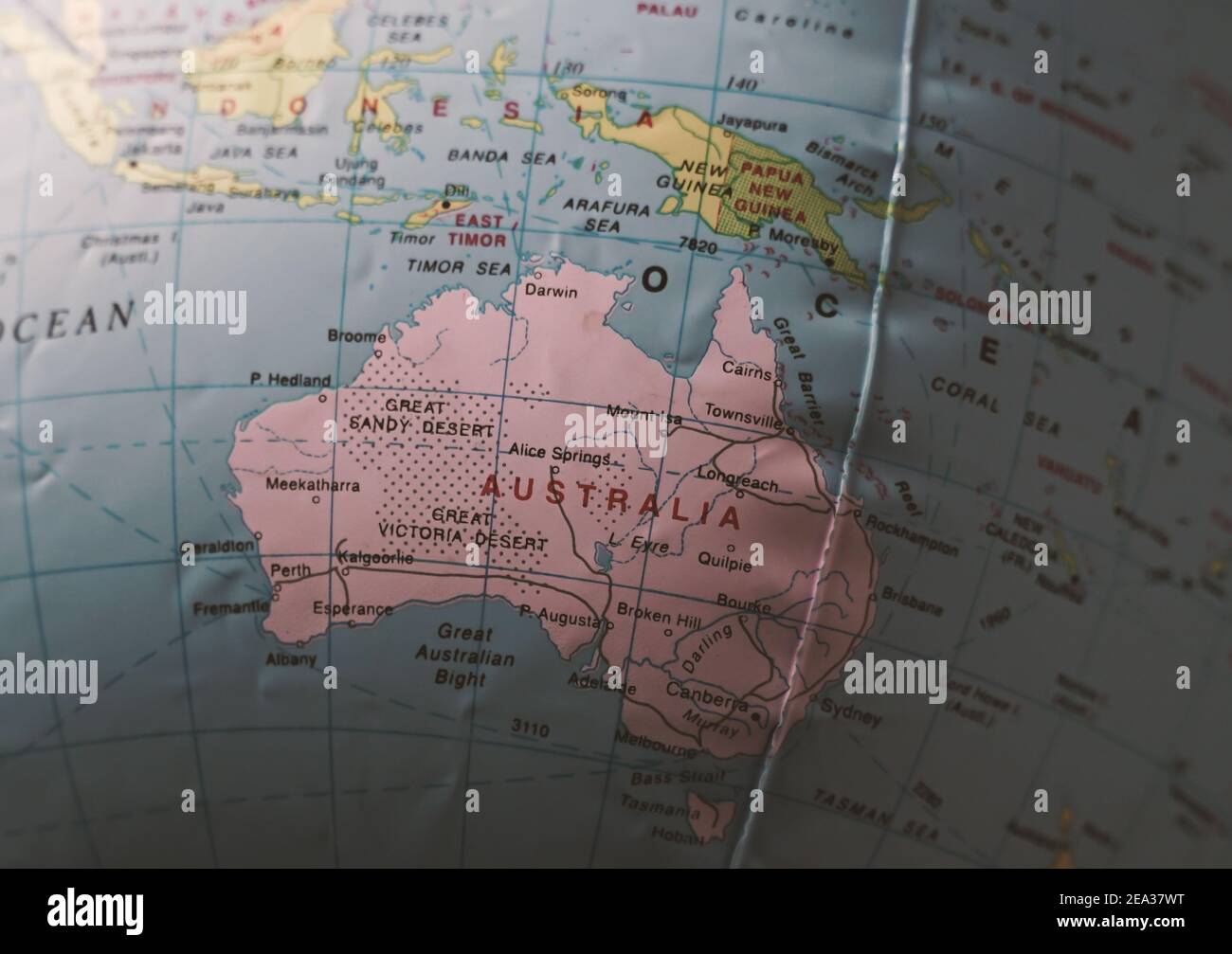 Australia on a world globe with shallow depth of field. Stock Photo