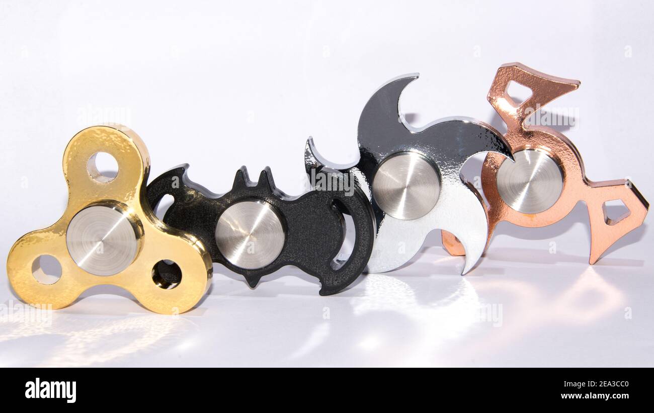 metal fidget spinners to relax, relieve stress, play  Stock Photo