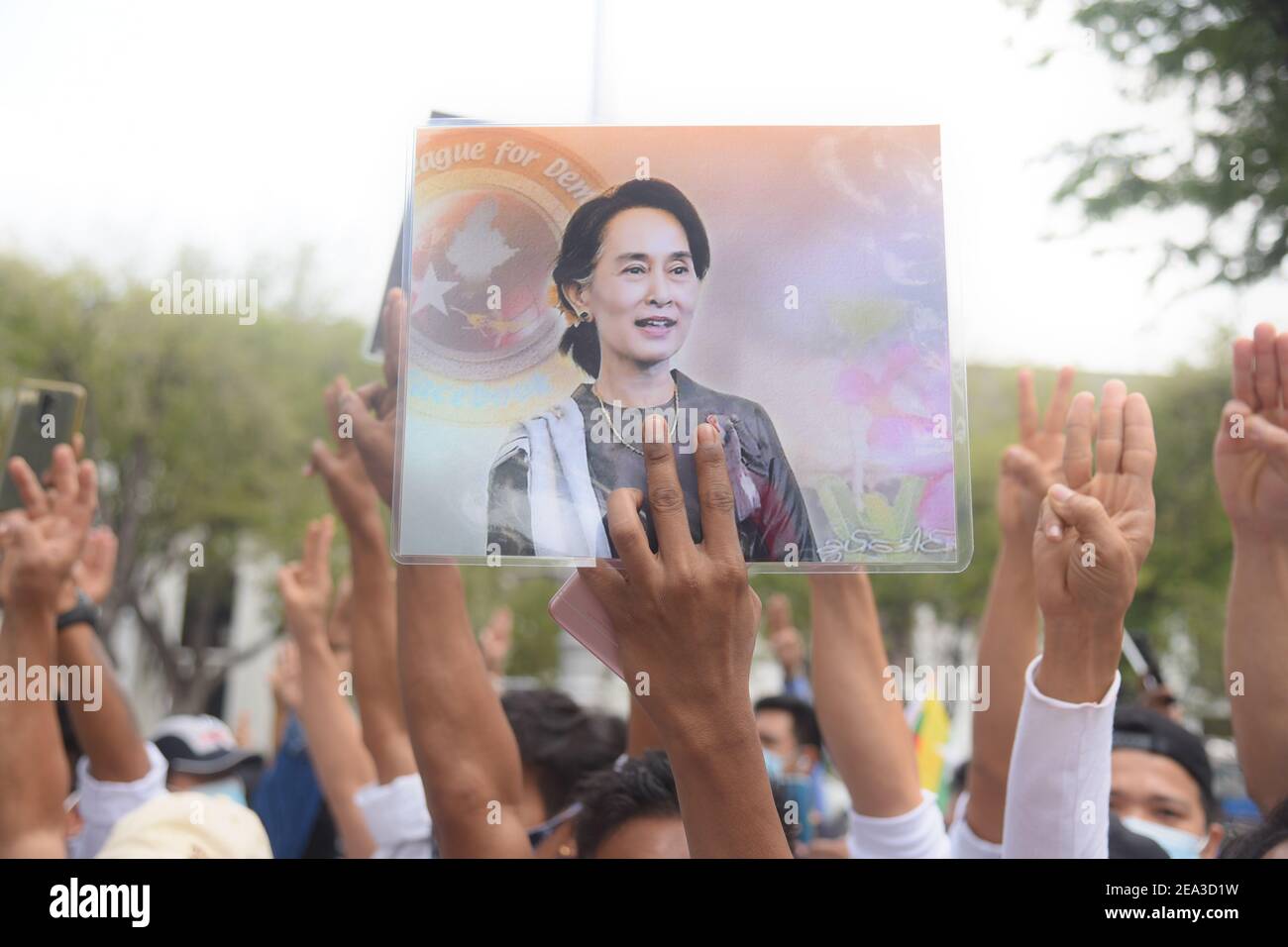 A protester holding up a portrait of the detained civilian leader Aung San Suu Kyi during the demonstration against the military coup.Citizens of Myanmar protest against the military coup in Myanmar outside United Nations venue in Bangkok. Stock Photo