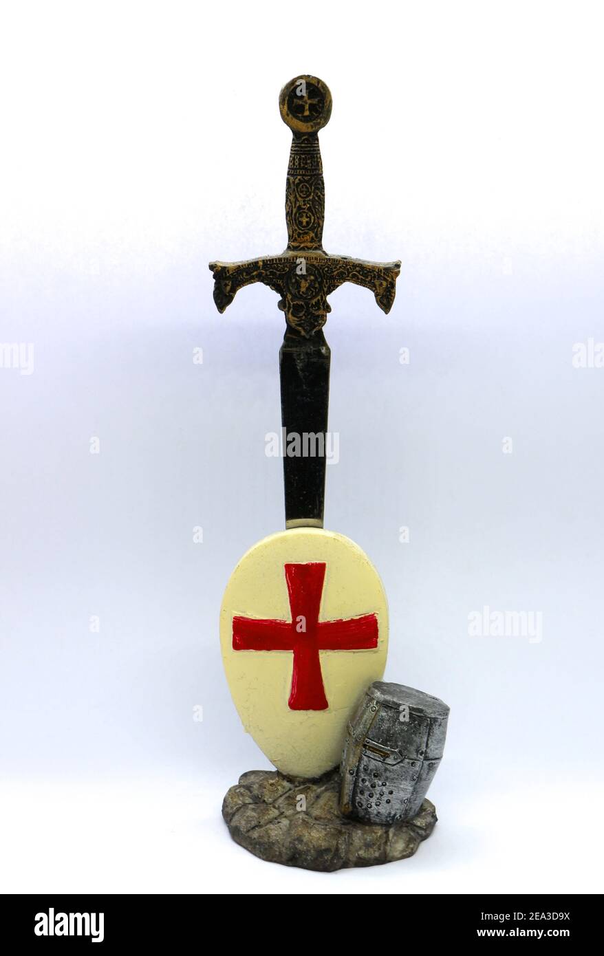 Metal ornament with a sword knight in armour helmet and shield with the