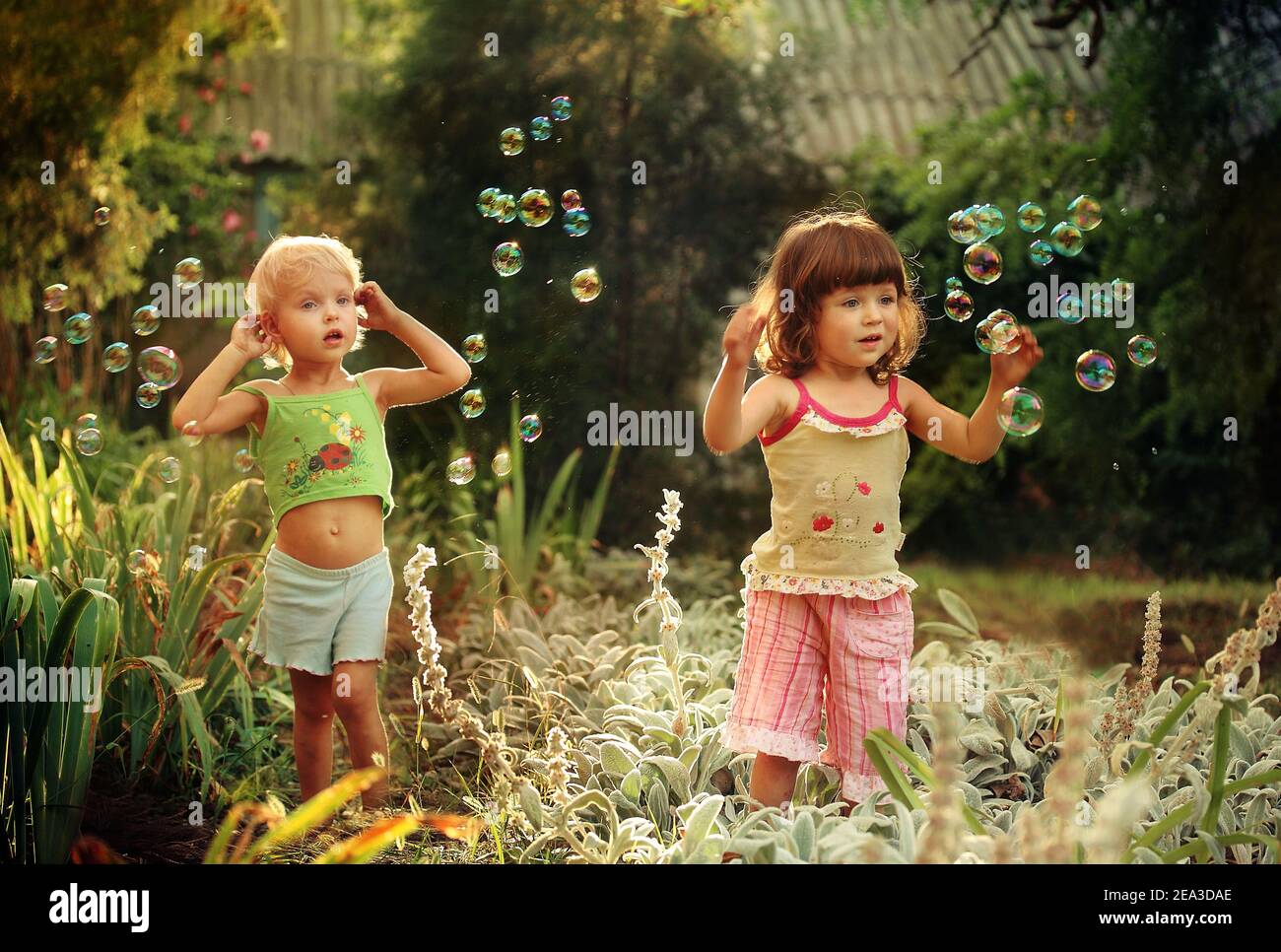 Girls in the park with soap bubbles Stock Photo - Alamy