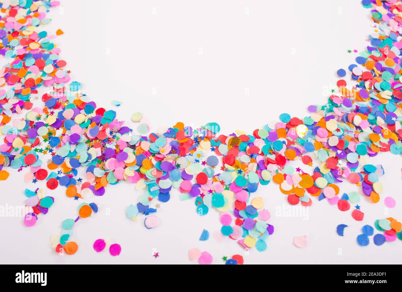 colorful confetti on a white background. Top view. Stock Photo