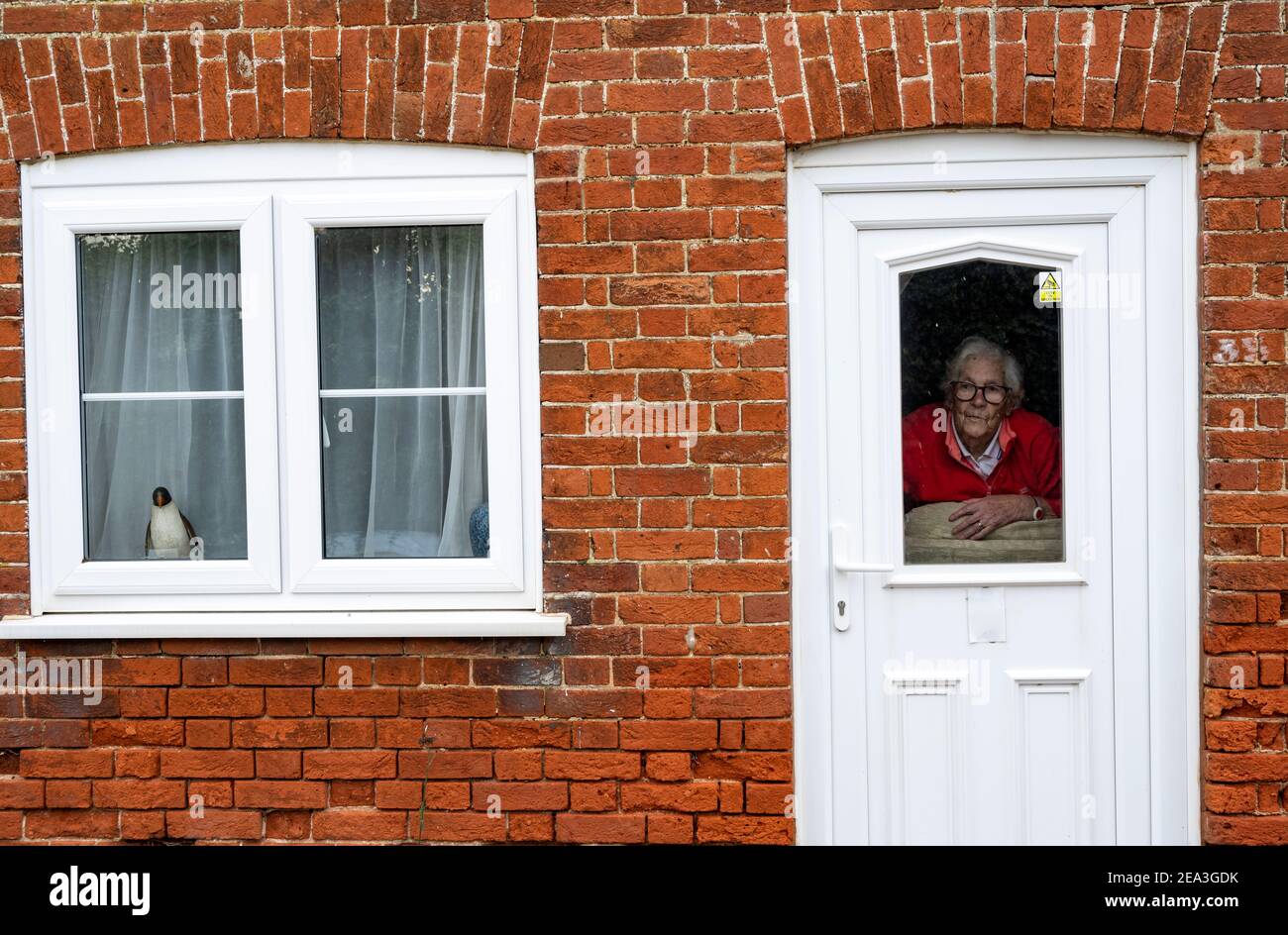 90 year old woman in self isolation because of Covid-19 Stock Photo