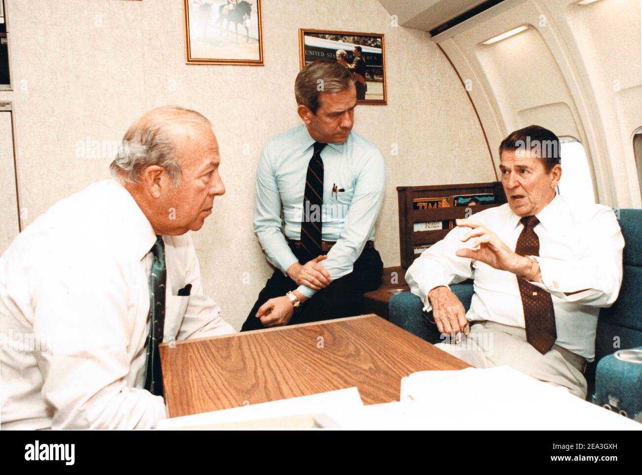 **File Photo** George Shultz Has Passed Away. In this photo released by the White House, United States President Ronald Reagan, right, directs actions to be taken on the situation in Beirut after being briefed aboard Air Force One by US Secretary of State George P. Shultz and National Security Advisor-designate Robert McFarlane on October 23, 1983. Mandatory Credit: Bill Fitz-Patrick/White House via CNP/MediaPunch Stock Photo