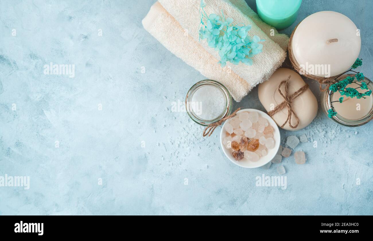 Spa set with care products on a soft blue background. Side view ...