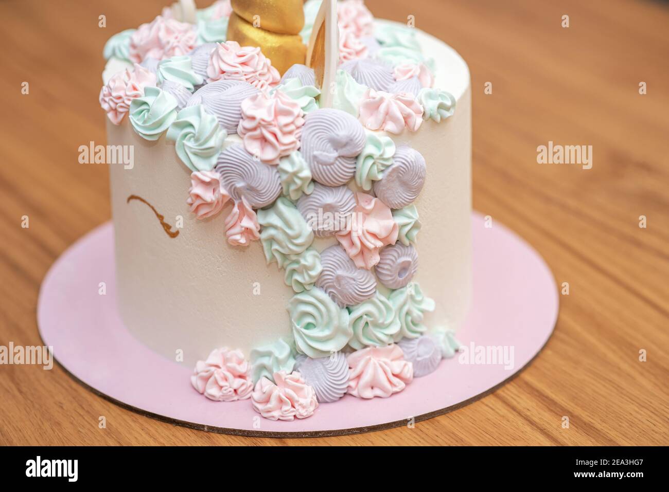 Unicorn cake decorated with multicolor pastel buttercream icing