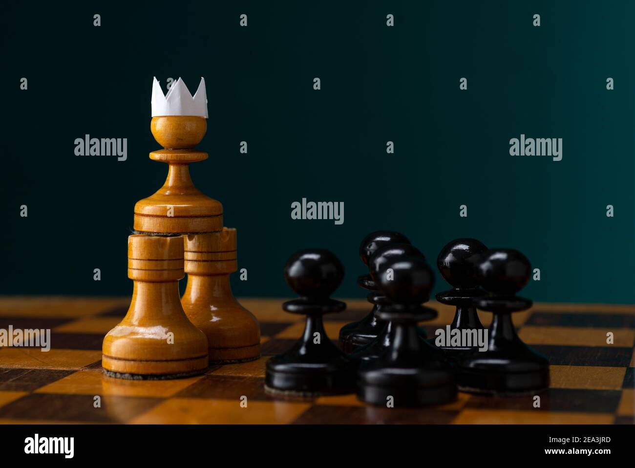 Investment Leadership Concept : The king chess piece with chess others  nearby go down from floating board game concept of business ideas and  competition and strategy plan success meaning. Stock Photo