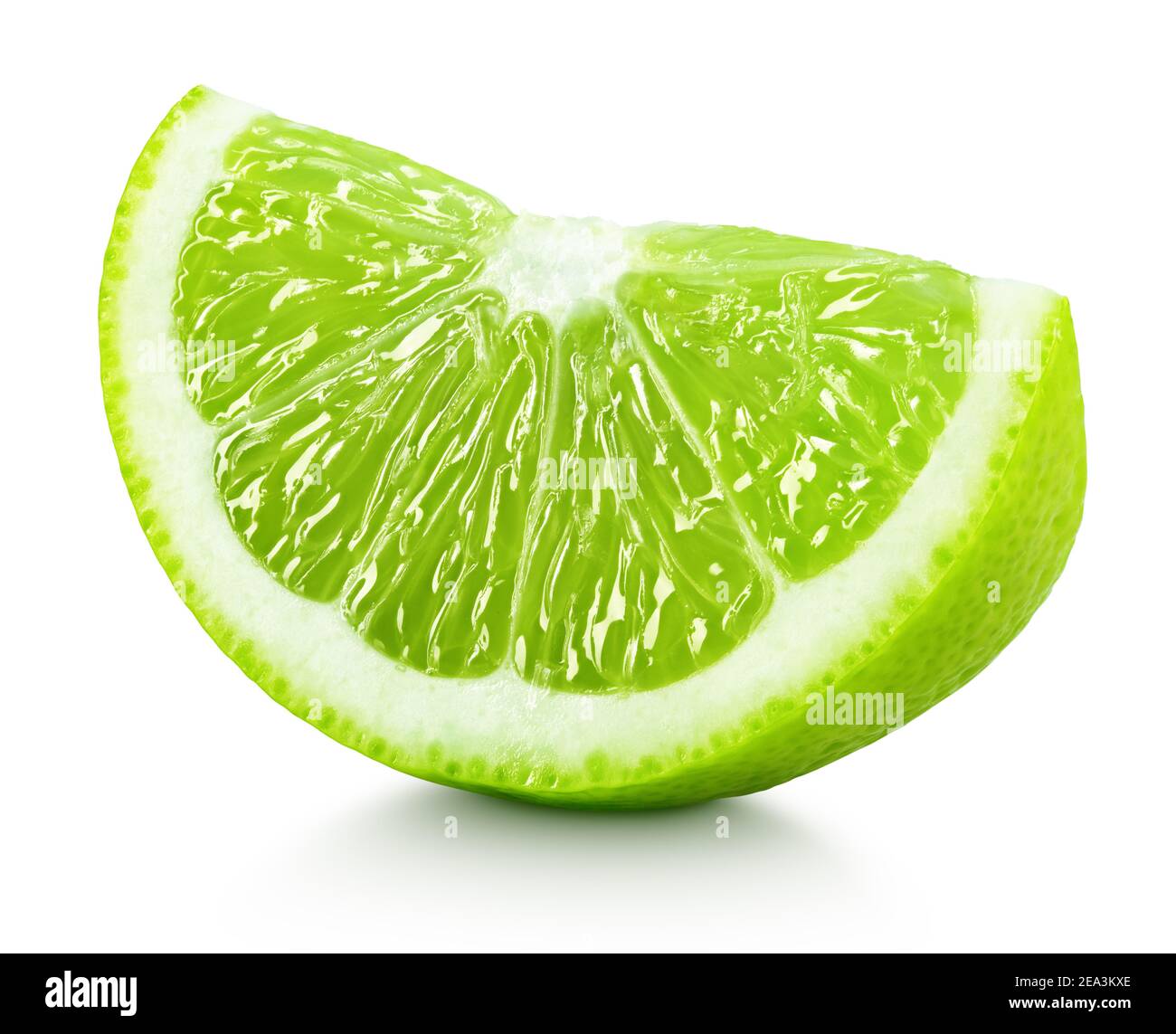 Ripe wedge of green lime citrus fruit isolated on white background. Lime slice with clipping path Stock Photo