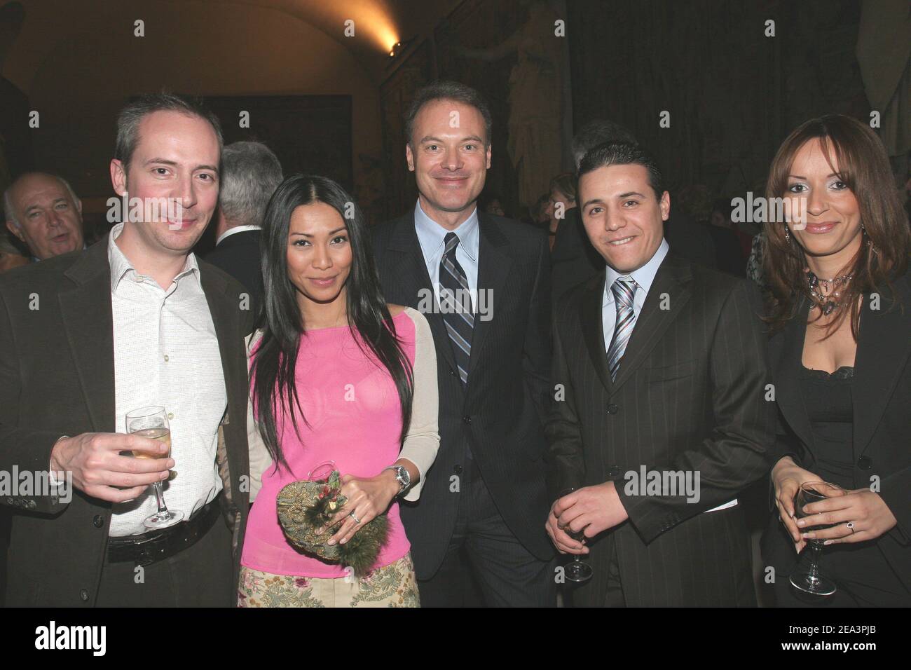 EXCLUSIVE. Indonesian born singer Anggun and her husband Oliver Maury (L), French Minister for Civil Service Renaud Dutreil (C), French rai singer Faudel and his girlfriend Anissa (R) during the 'Reims-Solidarite Tsunami' charity gala for the benefit of the tsunami victims held at the 'Palais du Tau' in Reims, France on April 8, 2005. The event has been initiated by French Minister for Civil Service Renaud Dutreil under the aegis of the UN Programme for Development and co-presided by Jean-Claude Brialy and Satya Oblet. Photo by Benoit Pinguet/ABACA. Stock Photo