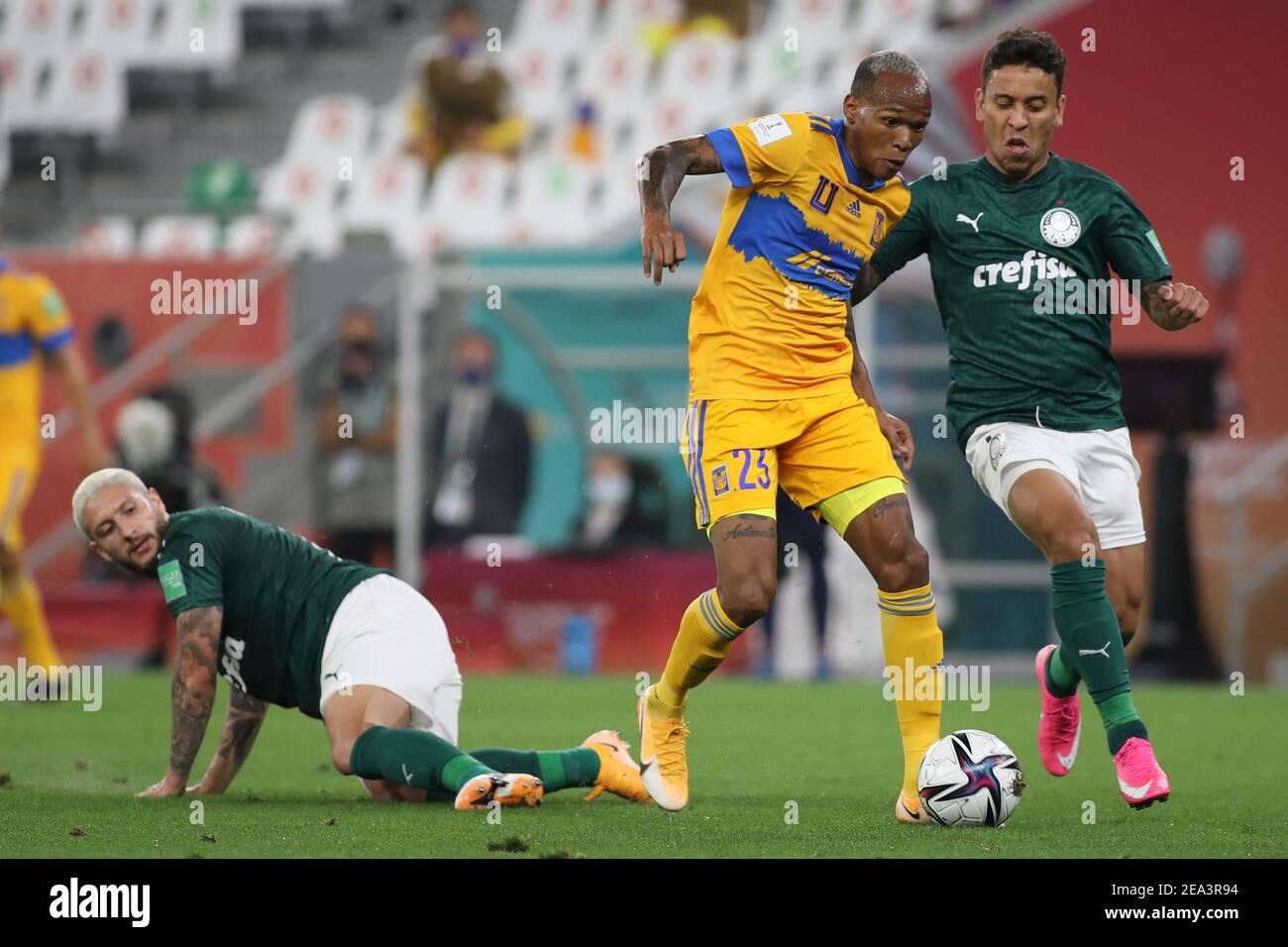 DOHA, QATAR - FEBRUARY 07: Luis Quiñones of Tigres UANL is chased down by Zé Rafael [left] and Marcos Rocha [right] of Palmeiras during the semi-final match between Palmeiras and Tigres UANL at Education City Stadium on February 7, 2021 in Doha, Qatar. (Photo by Colin McPhedran/MB Media) Stock Photo