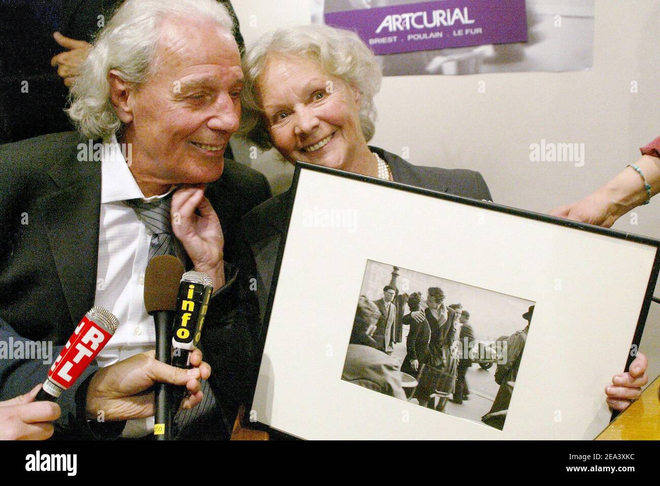 The woman featured in Robert Doisneau's photograph 'The Kiss', Franoise Bornet, poses at the Dassault auction house as an original print of Robert Doisneau's classic photograph 'Baiser de l'Hotel de Ville' (Kiss at City Hall) has been sold 155.000 Euros during an auction of a photography sale in Paris, France, on April 25, 2005. Photo by Mehdi Taamallah/ABACA. Stock Photo