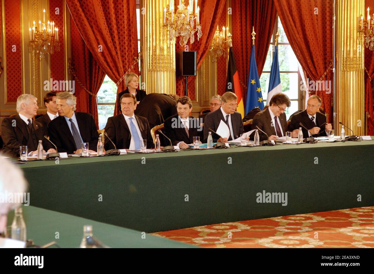 German interior minister Otto Schilly, interior minister Dominique de Villepin, Gerard Schroeder, Jean-Louis Borloo, German economy minister Wolfgang Clement, French finances minister Thierry Breton and German finances minister Hans Eichel during a Joint meeting of the French and German cabinets to discuss economic cooperation and the European Union constitution as polls overwhelmingly show the French could reject the treaty at the Elysee Palace in Paris Tuesday, April 26, 2005. Photo by Giancarlo Gorassini/ABACA. Stock Photo