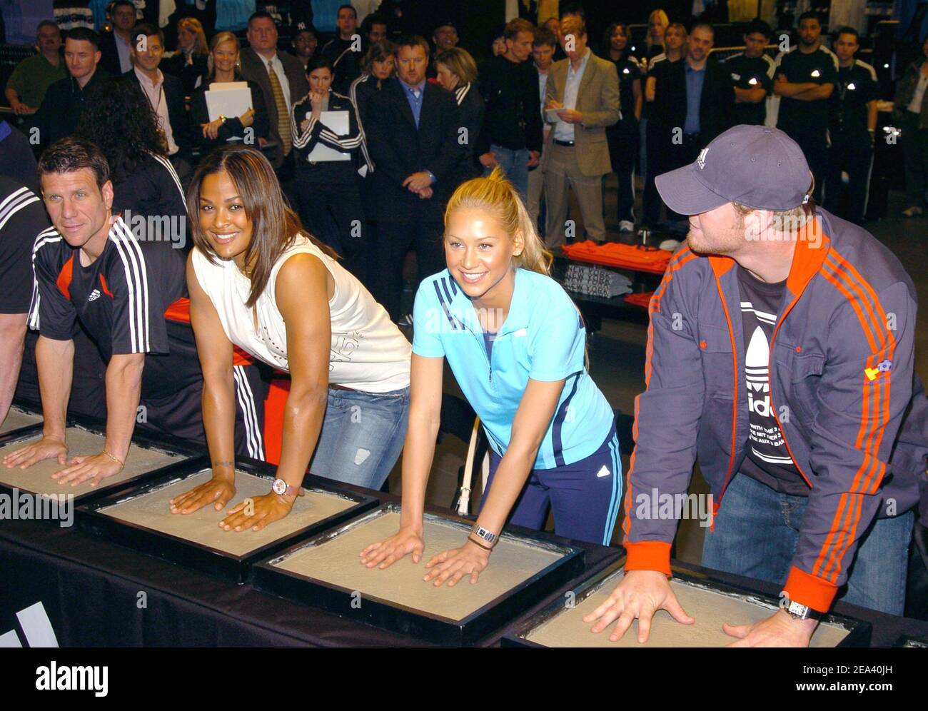 Soccer player Jeff Agoos, boxer Laila Ali, tennis player Anna Kournikova and NY Giants' Jeremy Shockey cast their handprints in cement during the Opening of the largest 'Adidas Sport Performance Store' in the World, at Downtown Manhattan in New York, USA, on May 7, 2005. Photo by Slaven Vlasic/CAMELEON/ABACA. Stock Photo