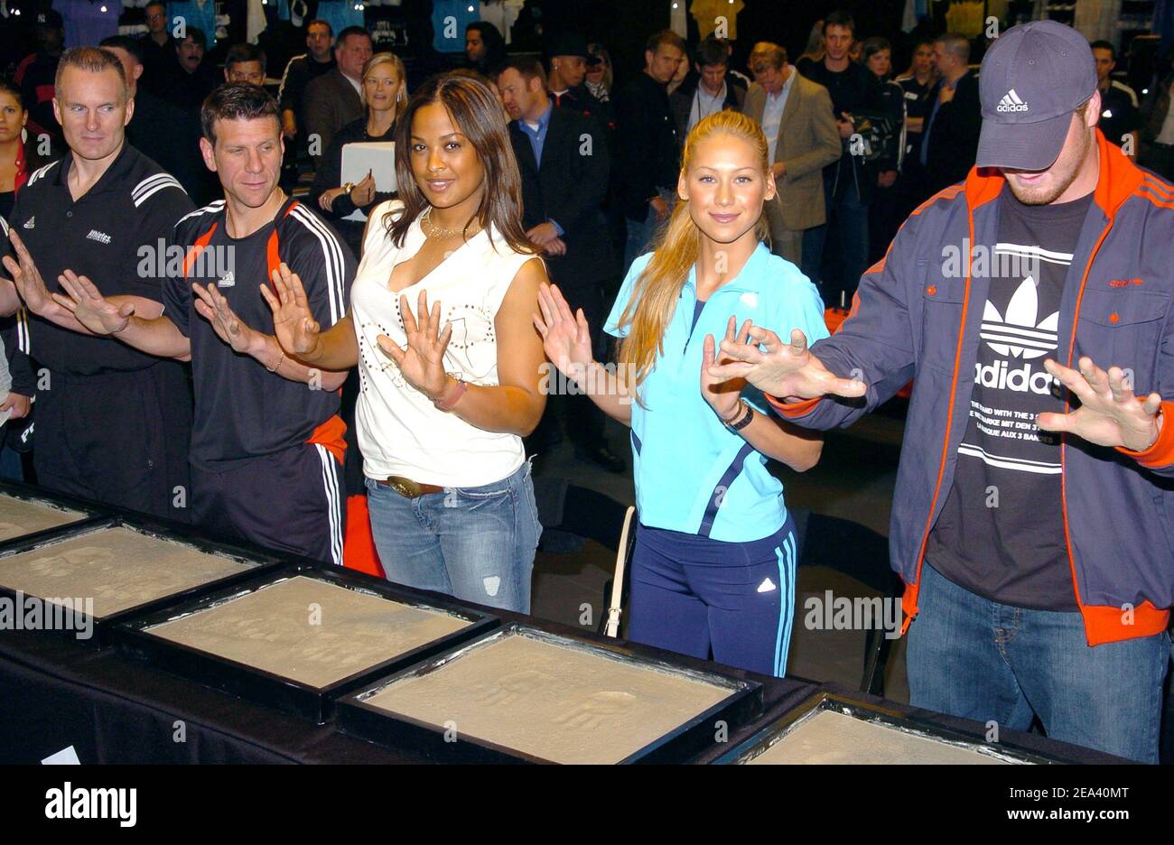 Founder/owner of Athletes' Performance Mark Verstegen, soccer player Jeff Agoos, boxer Laila Ali, tennis player Anna Kournikova and NY Giants' Jeremy Shockey cast their handprints in cement during the Opening of the largest 'Adidas Sport Performance Store' in the World, at Downtown Manhattan in New York, USA, on May 7, 2005. Photo by Slaven Vlasic/CAMELEON/ABACA. Stock Photo