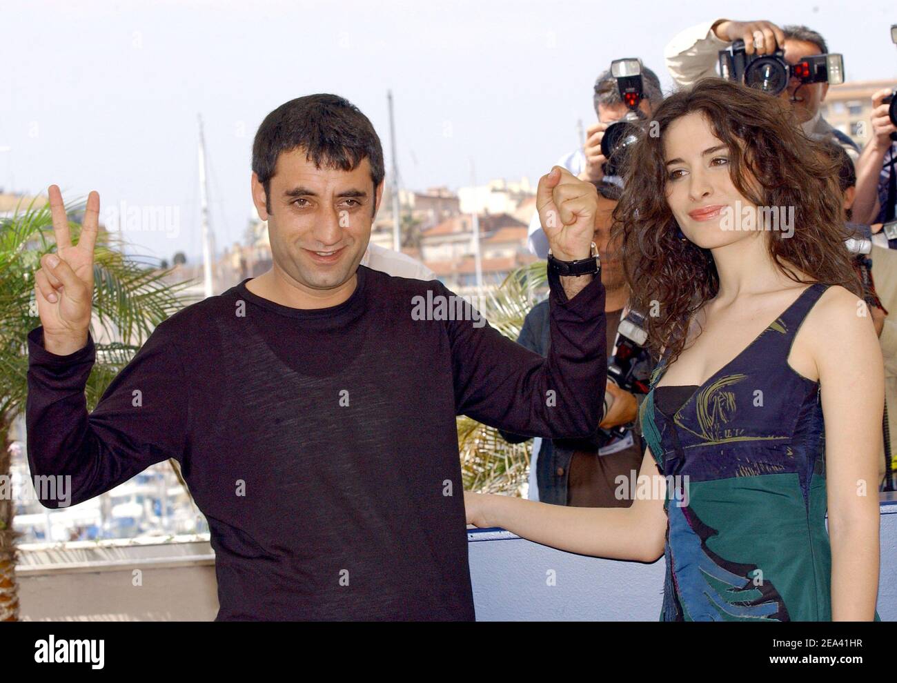 Turkish actors (r) Belcim Bilgin and Nazmi Kirik pose during a photocall for Iraqi-born director Hiner Saleem's film 'Kilometre Zero' at the 58th Cannes Film Festival, May 12, 2005. Photo by Hahn-Nebinger-Klein/ABACA Stock Photo