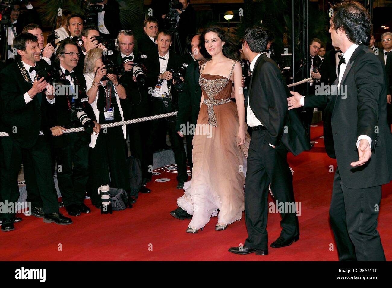 (L-R) Iraqi director Hiner Saleem, Turkish actors Belcim Bilgin and Nazim Kirik arrive for the screening of their movie, 'Kilometre Zero', during the 58th international Cannes film festival in Cannes, southern France, on May 12, 2005. Photo by Hahn-Nebinger-Klein/ABACA. Stock Photo