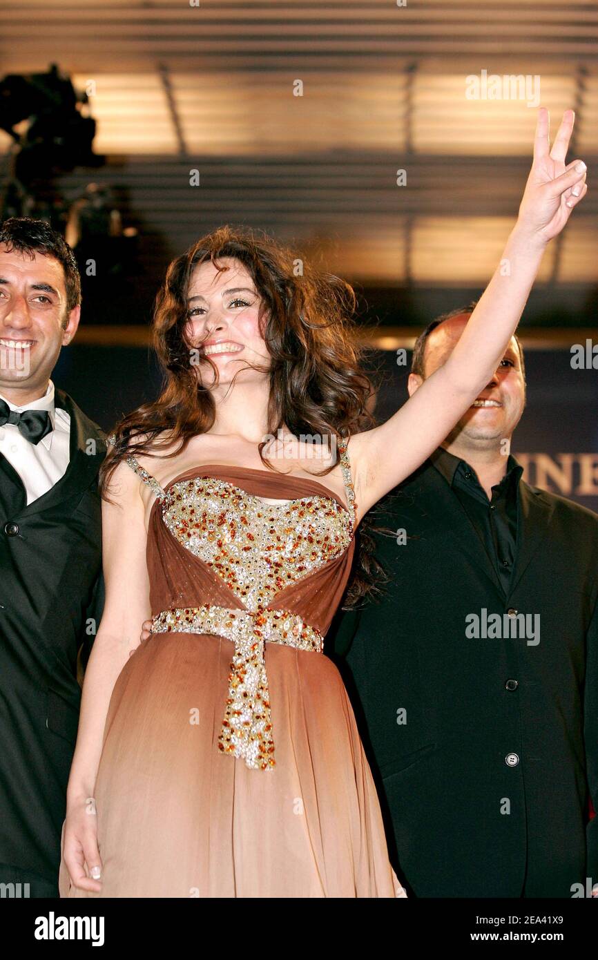 (L-R) Turkish actors Belcim Bilgin and Nazim Kirik with Iraqi director Hiner Saleem arrive for the screening of their movie, 'Kilometre Zero', during the 58th international Cannes film festival in Cannes, southern France, on May 12, 2005. Photo by Hahn-Nebinger-Klein/ABACA. Stock Photo