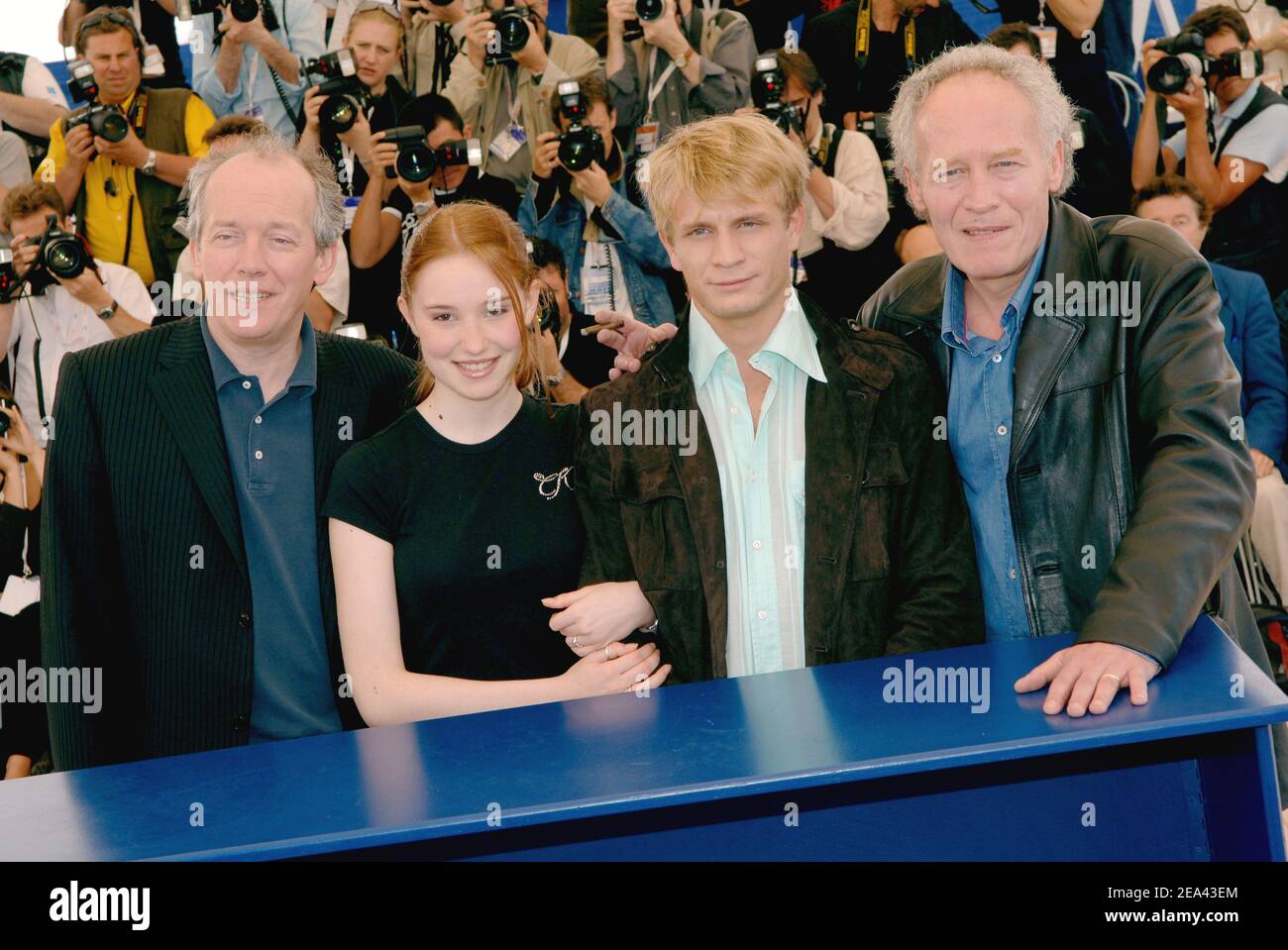 Belgian directors and brothers Jean-Pierre Dardenne (R) and Luc Dardenne  with cast members Deborah Francois and Jeremie Renier pose at the photocall  for their film 'The Child' during the 58th International Cannes