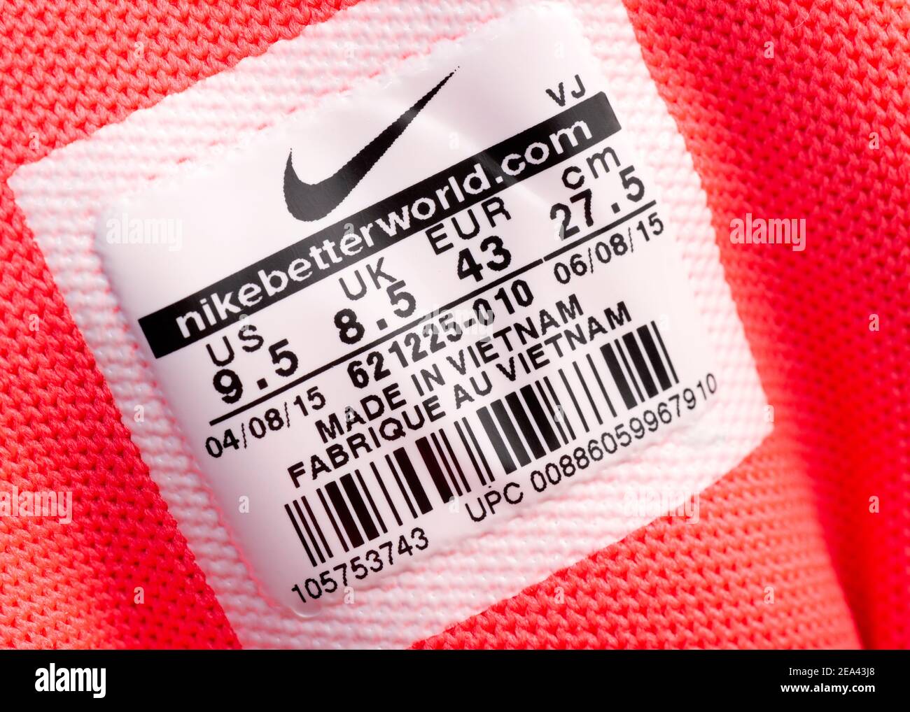 Nike Made in Vietnam label on pink tongue of Nike multi-color design  trainers from 2015 Stock Photo - Alamy
