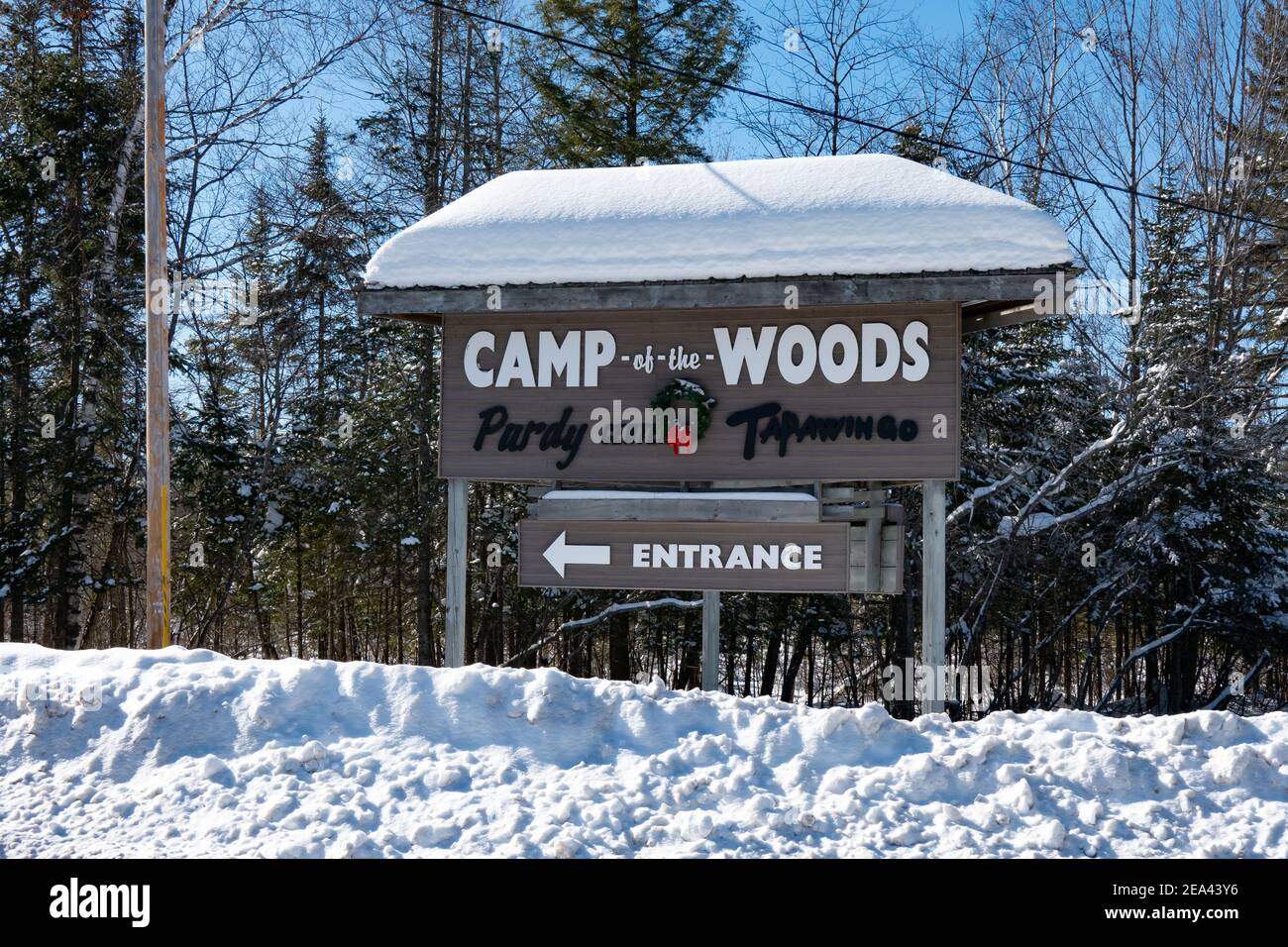 A sign at the entrance to Camp-of-the-Woods, a christian family resort / camp & conference center located in Speculator, NY on Lake Pleasant in winter Stock Photo