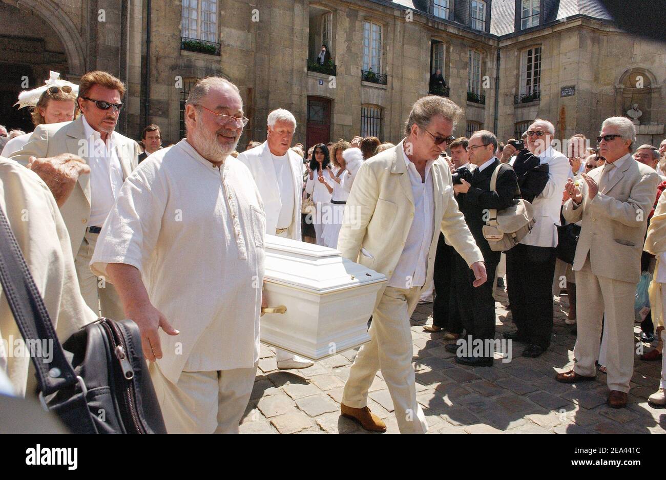 French singers Carlos, Johnny Hallyday, Eddy Mitchell and TV producer Stephane Collaro pay their last tribute to French music producer Eddie Barclay in Paris on May 18, 2005. Photo by Mousse-Gorassini/ABACA. Stock Photo