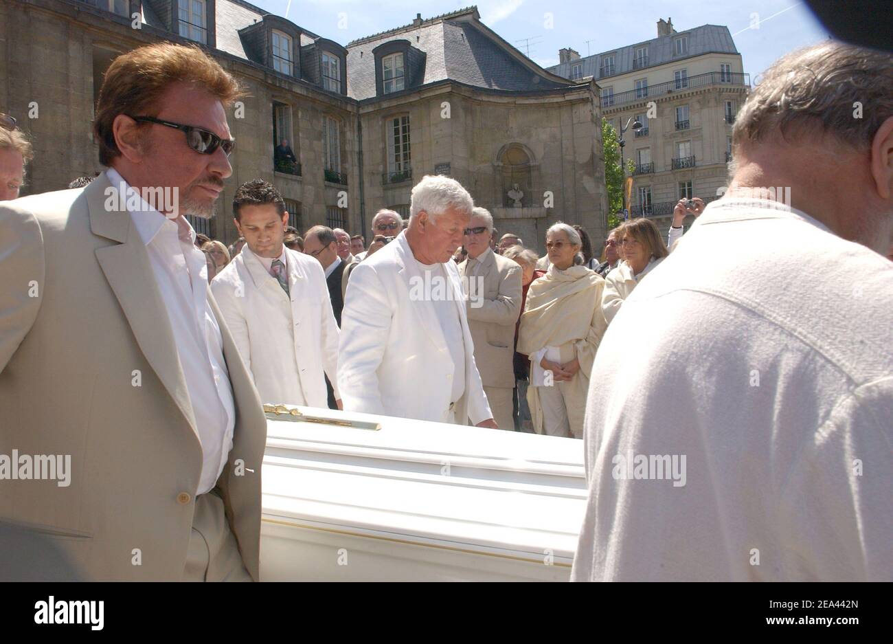 Singer Johnny Hallyday and Stephane Collaro carry the coffin at St-Germain-des-Pres church in Paris, France, on May 18, 2005, for a mass to pay a tribute to famous French music producer Eddie Barclay who died aged 84 on last Friday. Photo by Gorassini-Mousse/ABACA Stock Photo