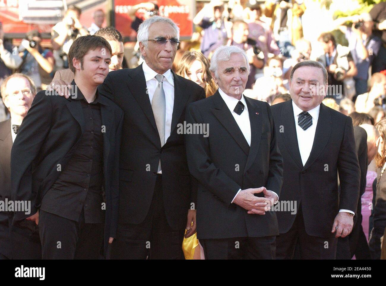 (L-R) Damien Jouillerot, Gerard Darmon, Charles Aznavour and Levon Sayan arrive for the screening of the film 'Peindre ou faire l'amour' directed by Arnaud and Jean-Marie Larrieu during the 58th International Film Festival, in Cannes, southern France, on May 18, 2005. Photo by Hahn-Nebinger-Klein/ABACA. Stock Photo