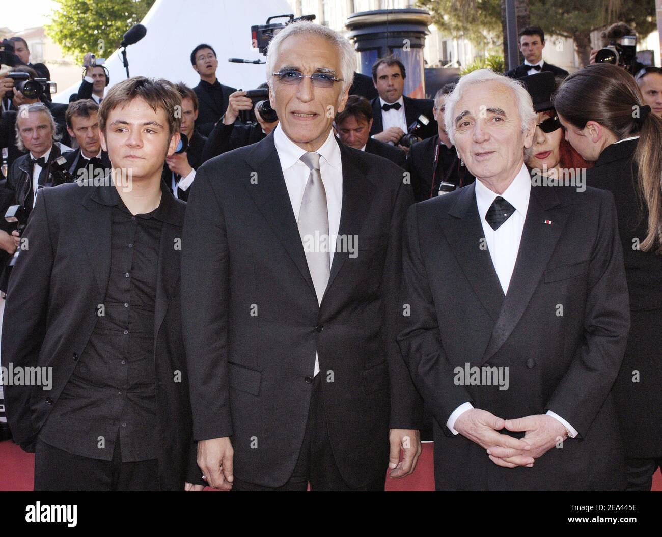 (L-R) Damien Jouillerot, Gerard Darmon and Charles Aznavour arrive for the screening of the film 'Peindre ou faire l'amour' directed by Arnaud and Jean-Marie Larrieu during the 58th International Film Festival, in Cannes, southern France, on May 18, 2005. Photo by Hahn-Nebinger-Klein/ABACA. Stock Photo