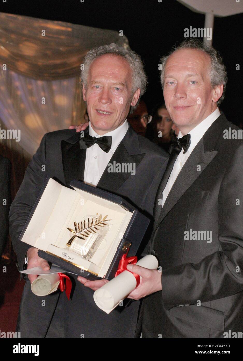 Palme d'Or winners Jean-Pierre and Luc Dardenne arrive to the 'Palmares Dinner' held at the Martinez Beach during the 58th International Cannes Film Festival, in Cannes, France on May 21, 2005. Photo by Benoit Pinguet/ABACA. Stock Photo