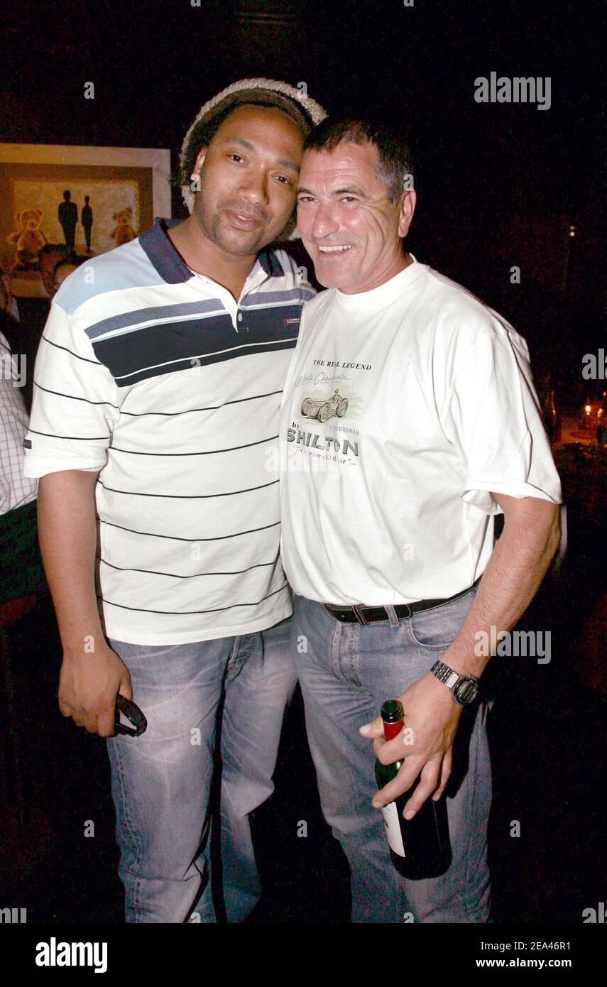 French singer Doc Gyneco and French humorist Jean-Marie Bigard have a dinner at L'etoile in Paris on May 24, 2005. Photo by Laurent Zabulon/ABACA. Stock Photo