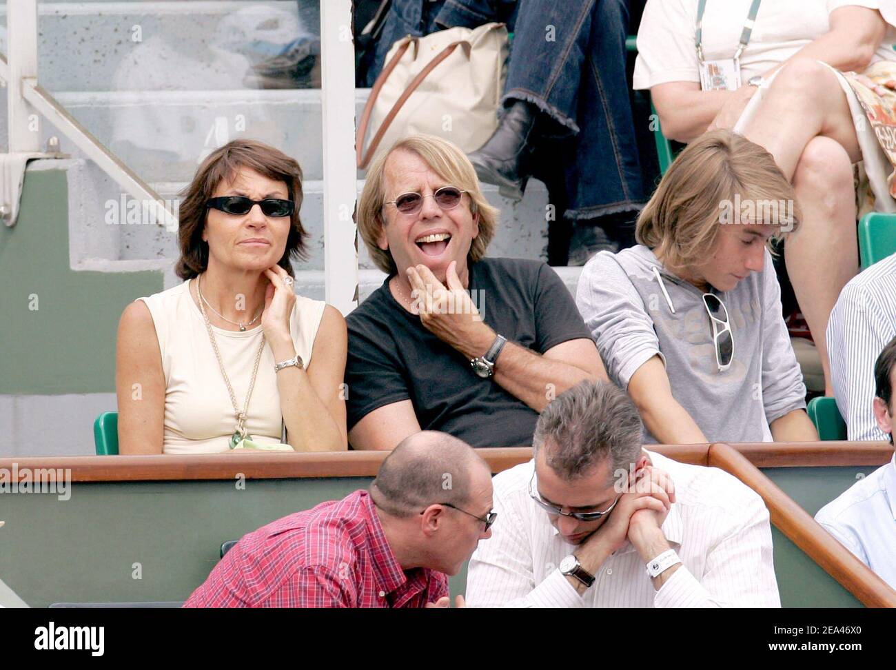 Cameroon's soccer team selector Claude Leroy and his wife attend the match  between France's Richard Gasquet and Peter Wessels from the Netherlands in  the French Open at the Roland Garros stadium in