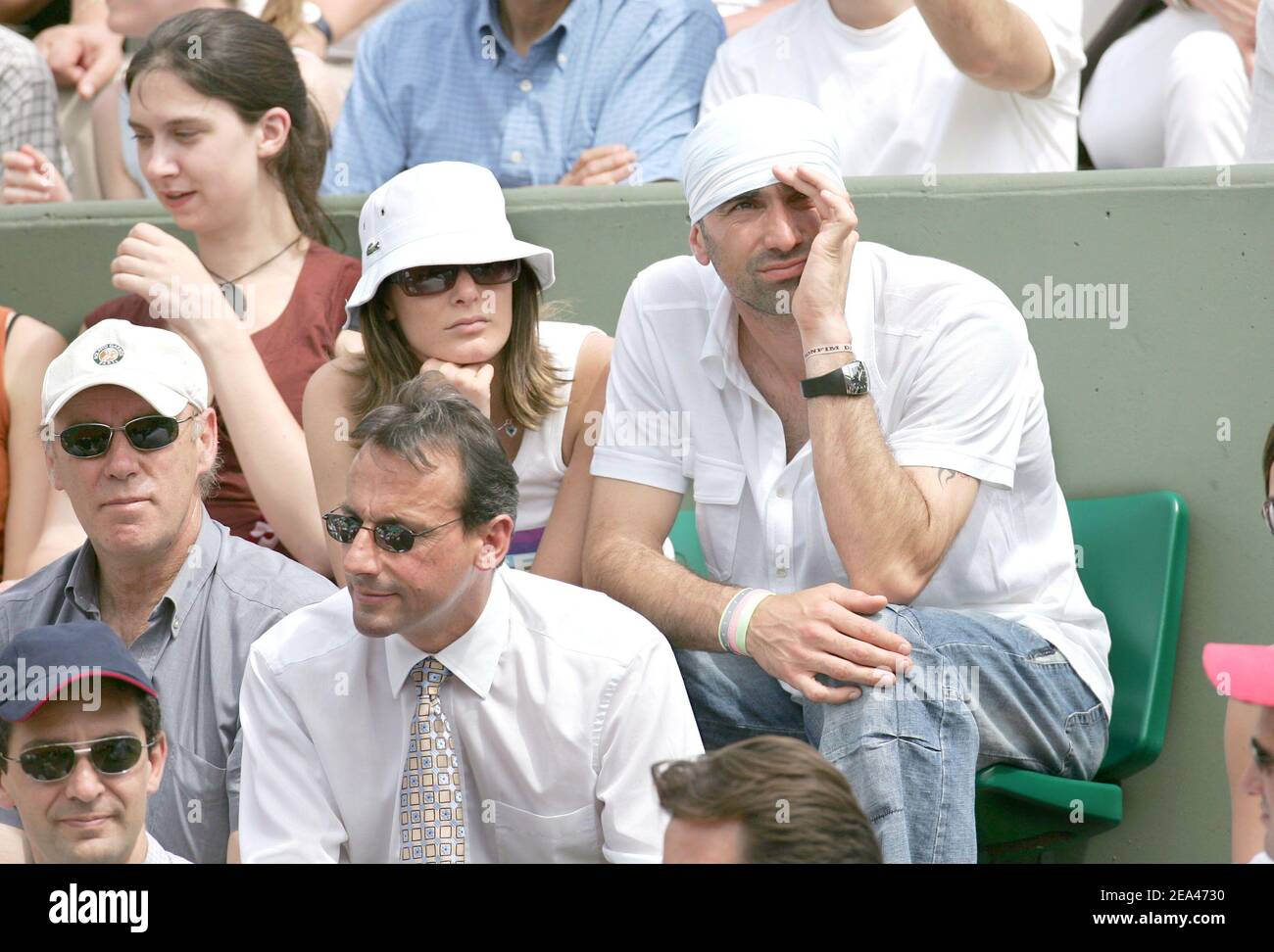 French soccer player (PSG) Jerome Alonzo and a female friend attend the match between French players Amelie Mauresmo and Alize Cornet in the second round of the French Open at the Roland Garros stadium in Paris, France, on May 26, 2005. Photo by Gorassini-Zabulon/ABACA. Stock Photo