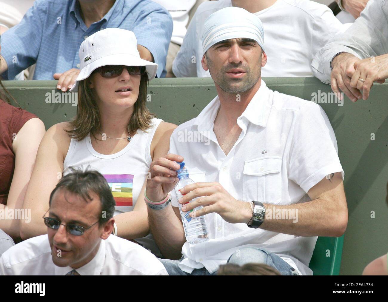 French soccer player (PSG) Jerome Alonzo and a female friend attend the match between French players Amelie Mauresmo and Alize Cornet in the second round of the French Open at the Roland Garros stadium in Paris, France, on May 26, 2005. Photo by Gorassini-Zabulon/ABACA. Stock Photo
