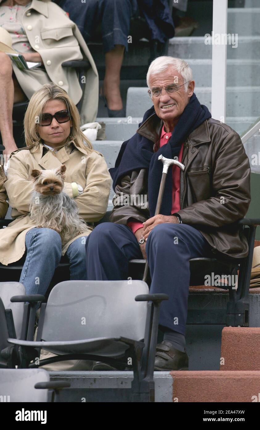 French actor Jean-Paul Belmondo and his wife Natty attend the match between  France's Sebastien Grosjean and Spain's Rafael Nadal in the fourth round of  the French Open at the Roland Garros stadium